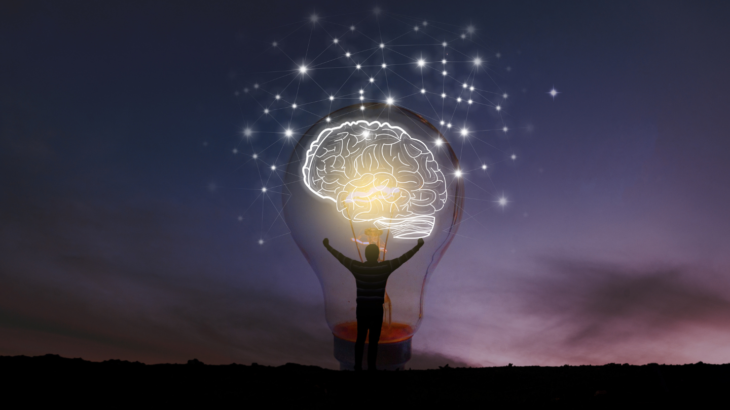 A person inside standing inside a lightbulb