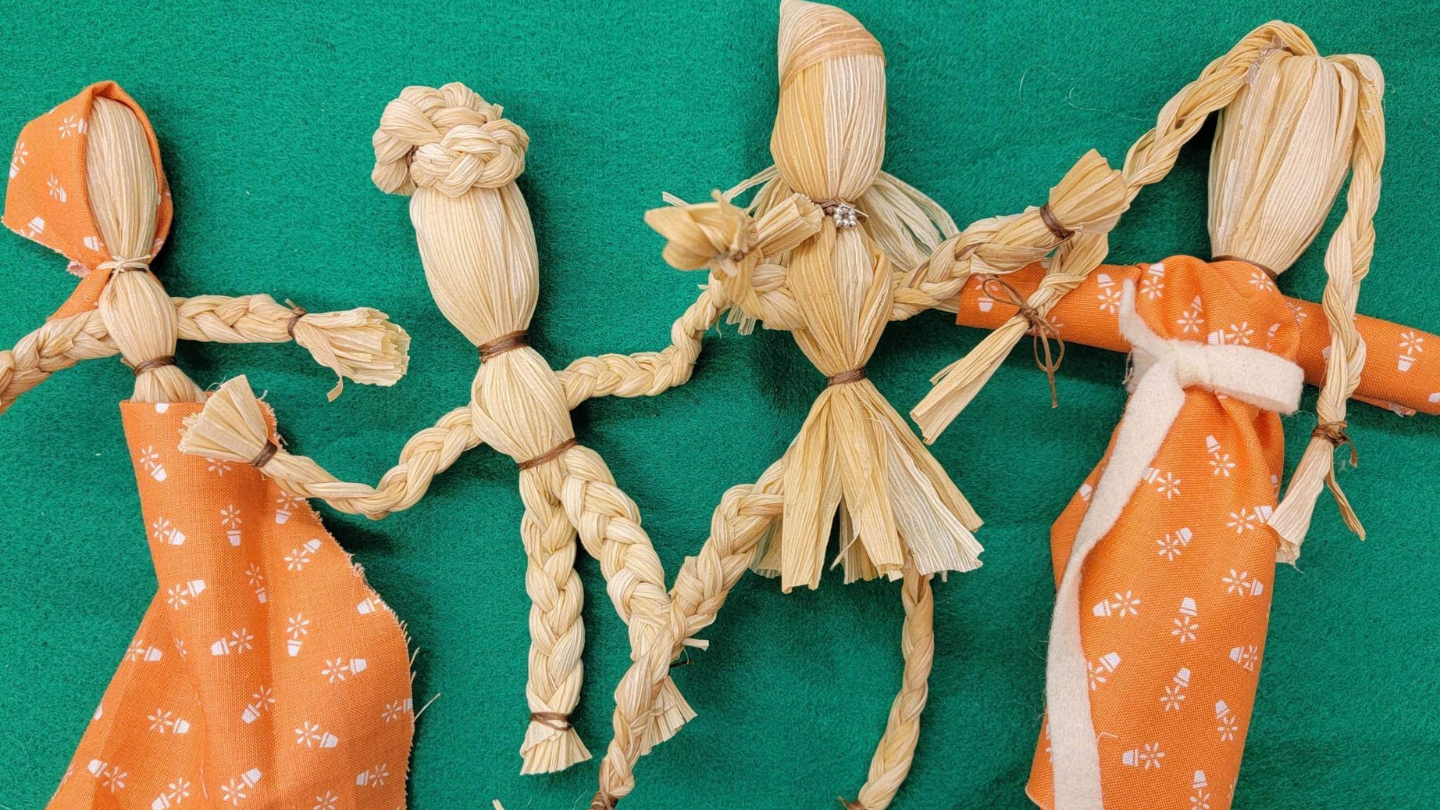 Wooden figurines dressed up as a group of indigenous people