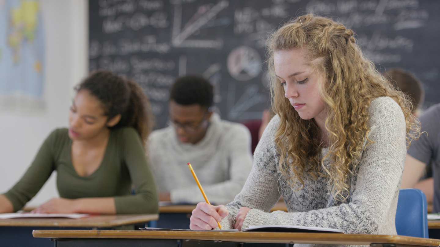 a group of students studying in a classroom