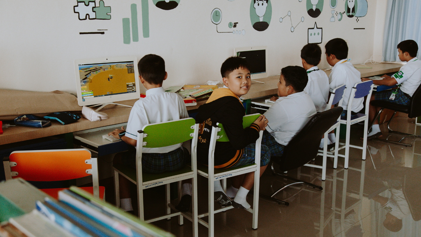 a group of students working in a computer lab