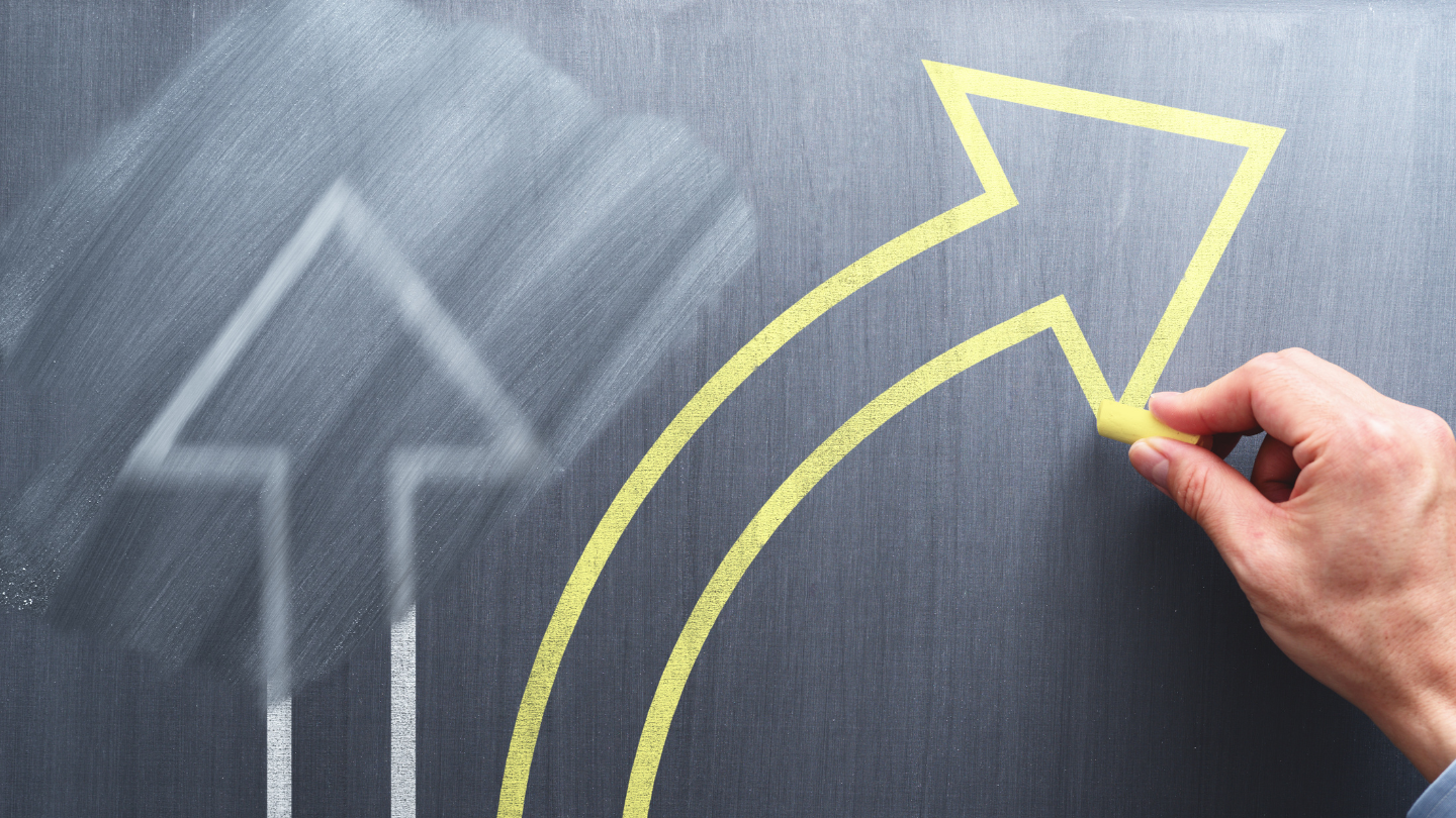 a straight arrow being erased for an arrow going sideways depicting change