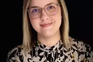 Tiina Kukkonen smiling at the camera