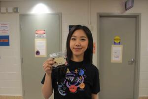 Rachel Su posing at Neurovibes 2025 with her name tag. 