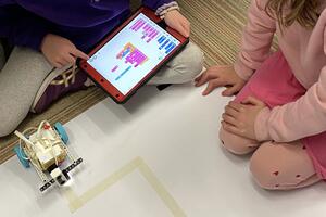 Students learning coding on Scratch together