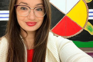 Alicia smiles at the camera