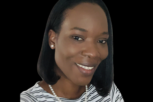 Tracy smiles at the camera wearing a striped shirt with shoulder length dark hair. 