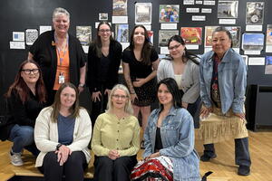 Telling our stories team whcih is a group of people smiling at the camera 