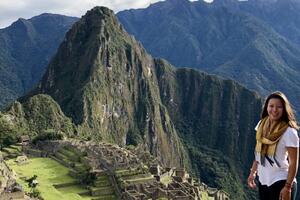 Kristin Lum-Tuong stands in front of a mountain.