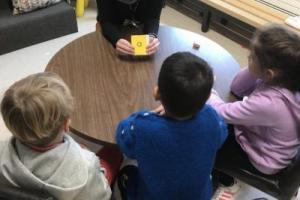 Emily Moorhead at table with students