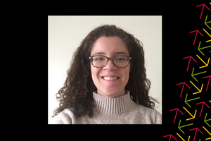 Lizzy Hinds-Hueglin smiles against a white wall. There is a black border and yellow, red, and green arrows overlayed over the right side.