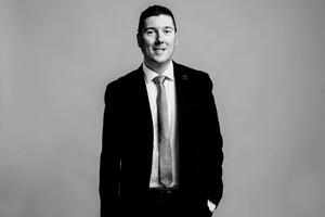 A black and white photo of Mitch Champagne.