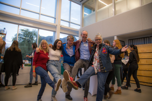 People dancing at a homecoming event