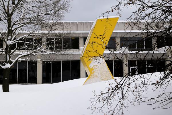Bent Yellow sculpture in the snow 