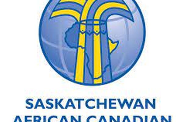 blue and yellow ribbons come down on a globe over Africa