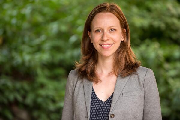Heather McGregor smiles outside wearing a grey blazer.