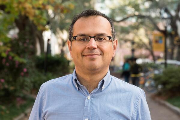 Nenad Radakovic smiles outside.