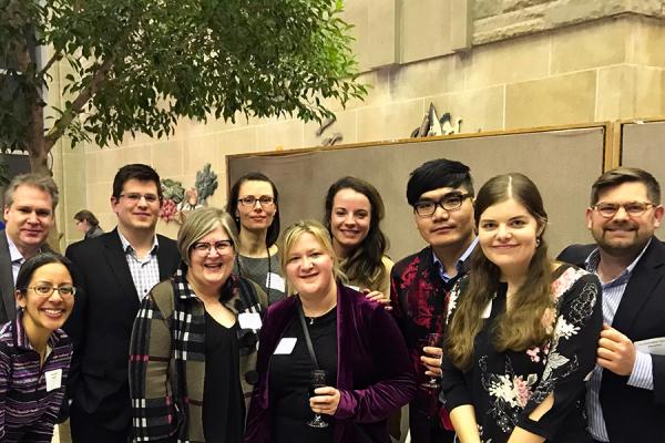 A group of students, faculty, and Dean Luce-Kapler at Faculty Share event