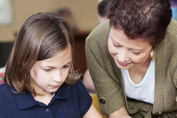 a teacher and a student in a classsroom