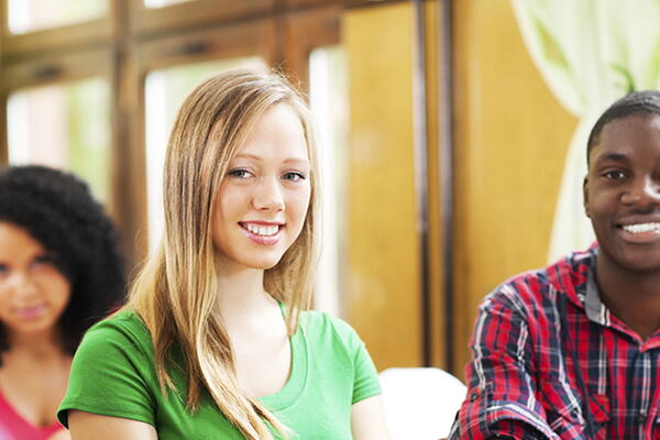 a group of students smiling at the camera