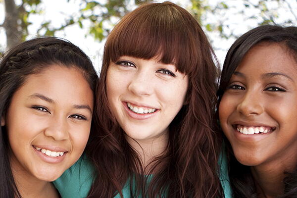 a group of people smiling at the camera