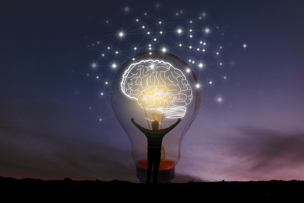 A person inside standing inside a lightbulb
