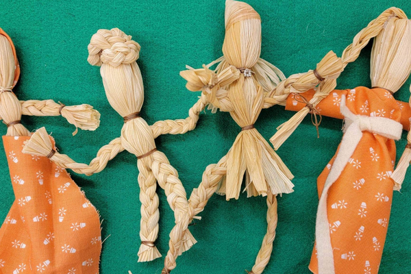 Wooden figurines dressed up as a group of indigenous people