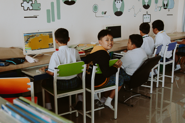 a group of students working in a computer lab