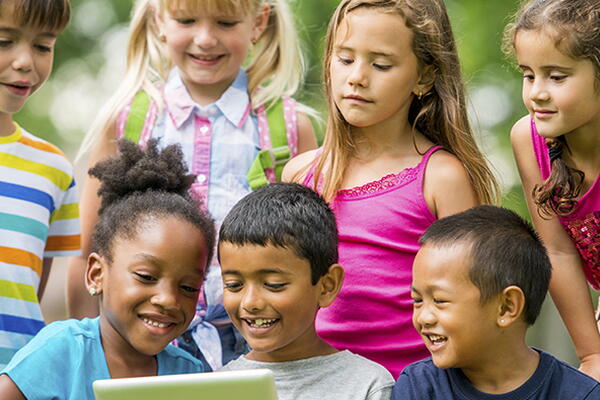a group of kids reading