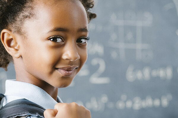 a student smiling at the camera