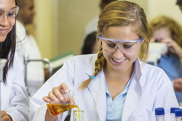a group of students working in a chemistry lab