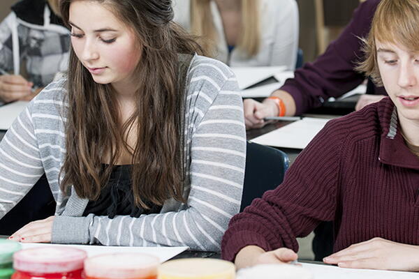 a group of students working in a classroom