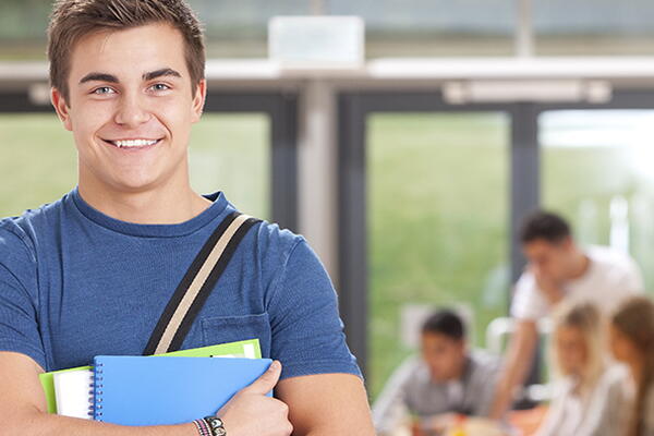 a student smiling at the camera