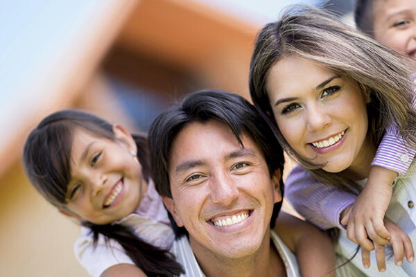 a family smiling at the camera