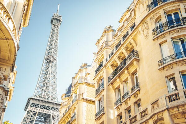 a street in france showing the eiffel tower