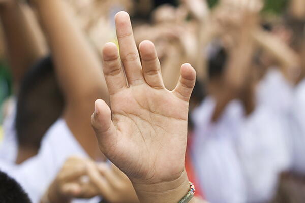 a picture of a group of people's hands raised