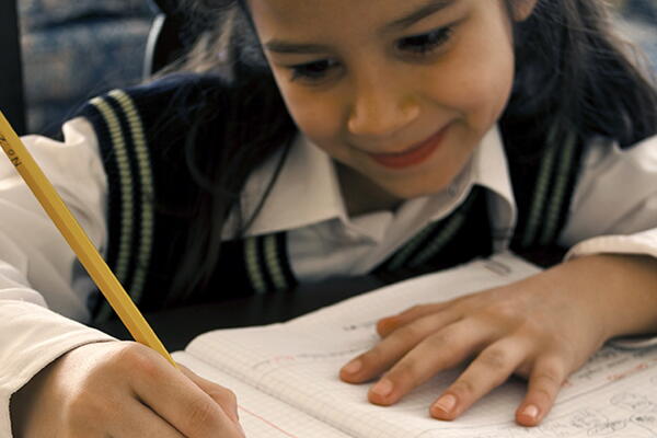 a student working on their notebook