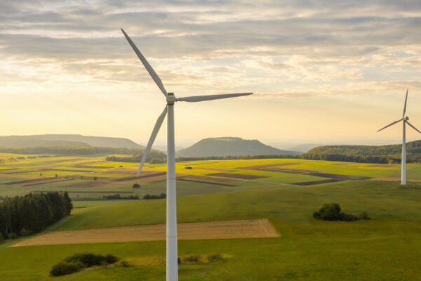 a picture of a landscape with windmills