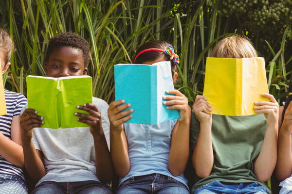 five students reading books