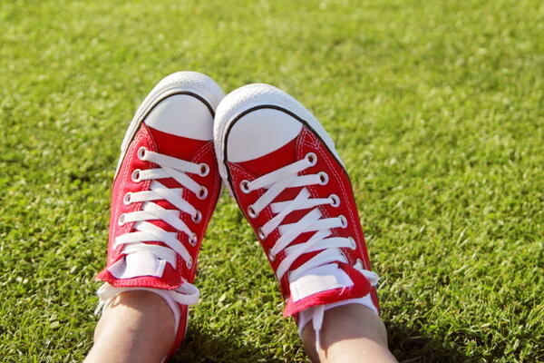 a picture of someone's shoes in a park