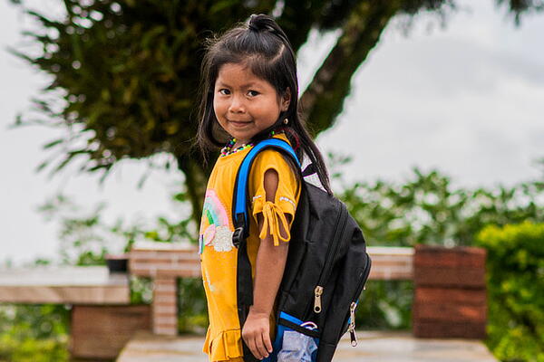 a child smiling at the camera
