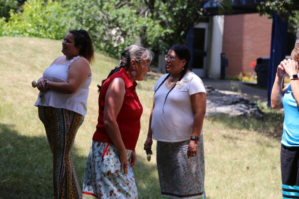Three people outside 