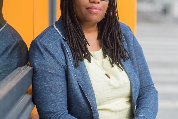 Cheryl Thompson from Ryerson University sitting with her hands crossed with glasses on 