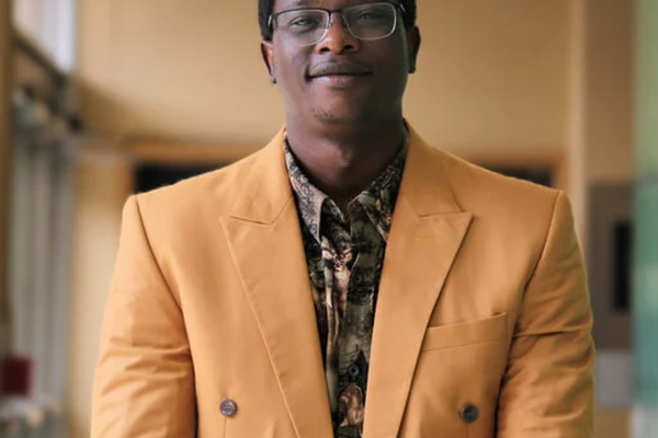 Ikeoluwapo Baruwa smiling at the camera
