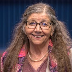 Maria Myers smiling in the auditorium