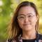 Claire Ahn smiling in front of trees outside