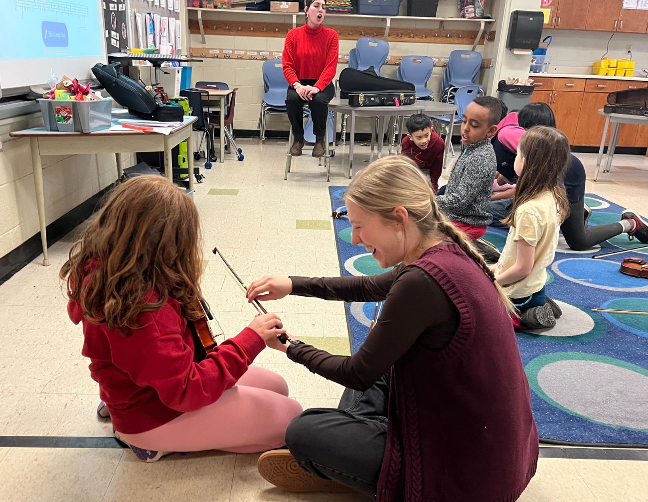 Molly with a Sistema student
