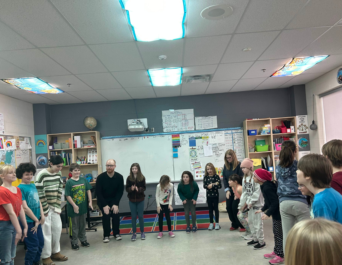 Hannah with students during circle time