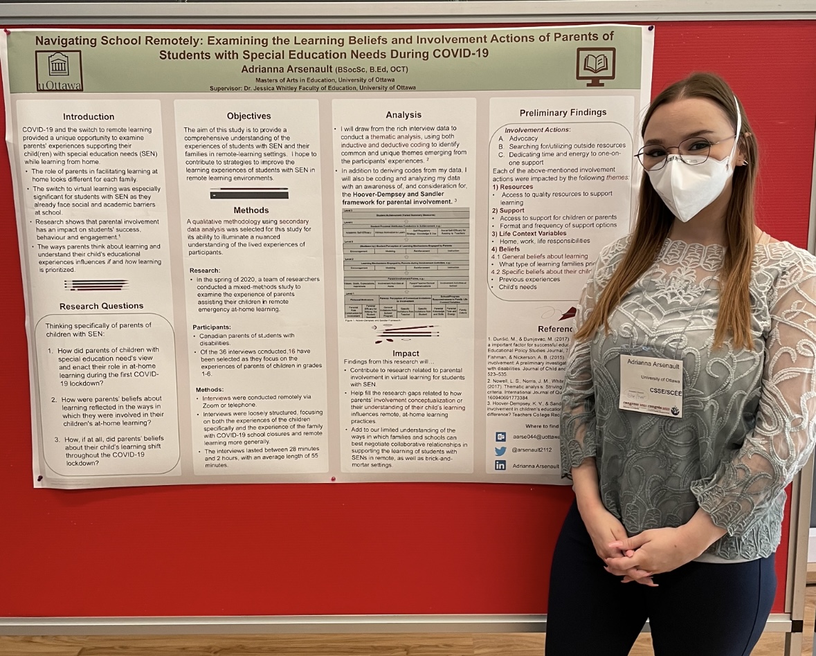 Adrianna Arsenault, a blond woman wearing glasses and a face mask, stands to the left of a poster titled "Navigating School Remotely: Examining the Learning Beliefs and Involvement Actions of Parents of Students with Special Education Needs During COVID-19