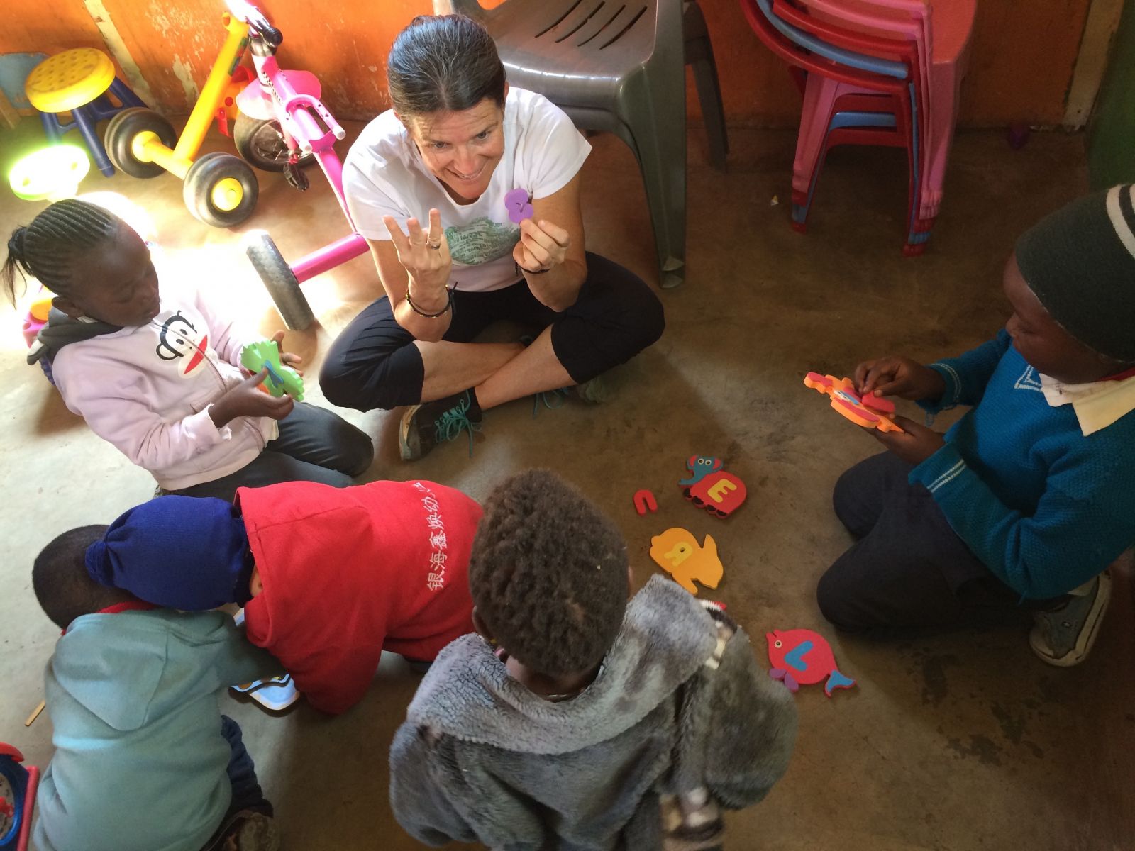 Shelley Mulrooney with children at Living Positive in Kenya 