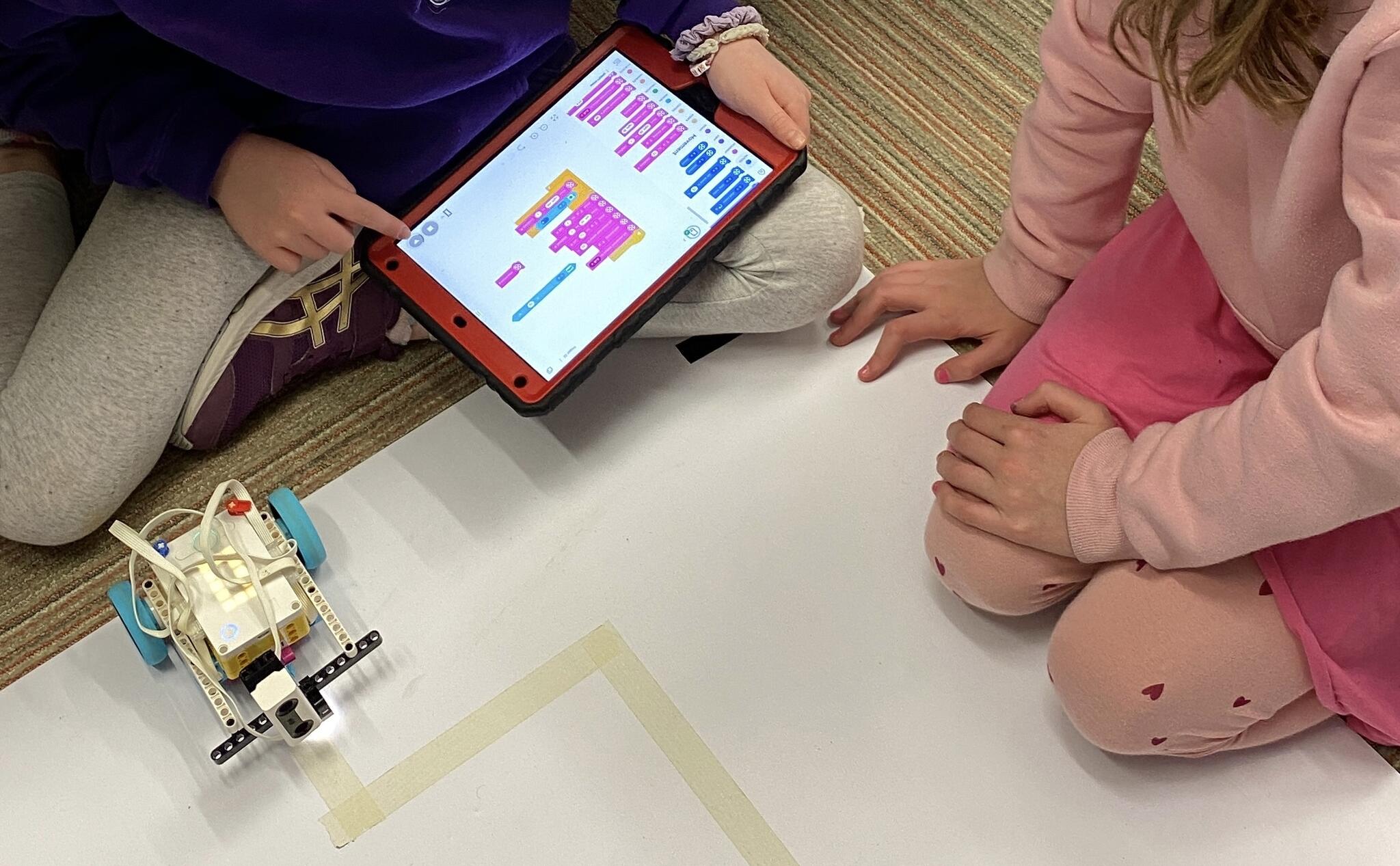 Students learning code on Scratch